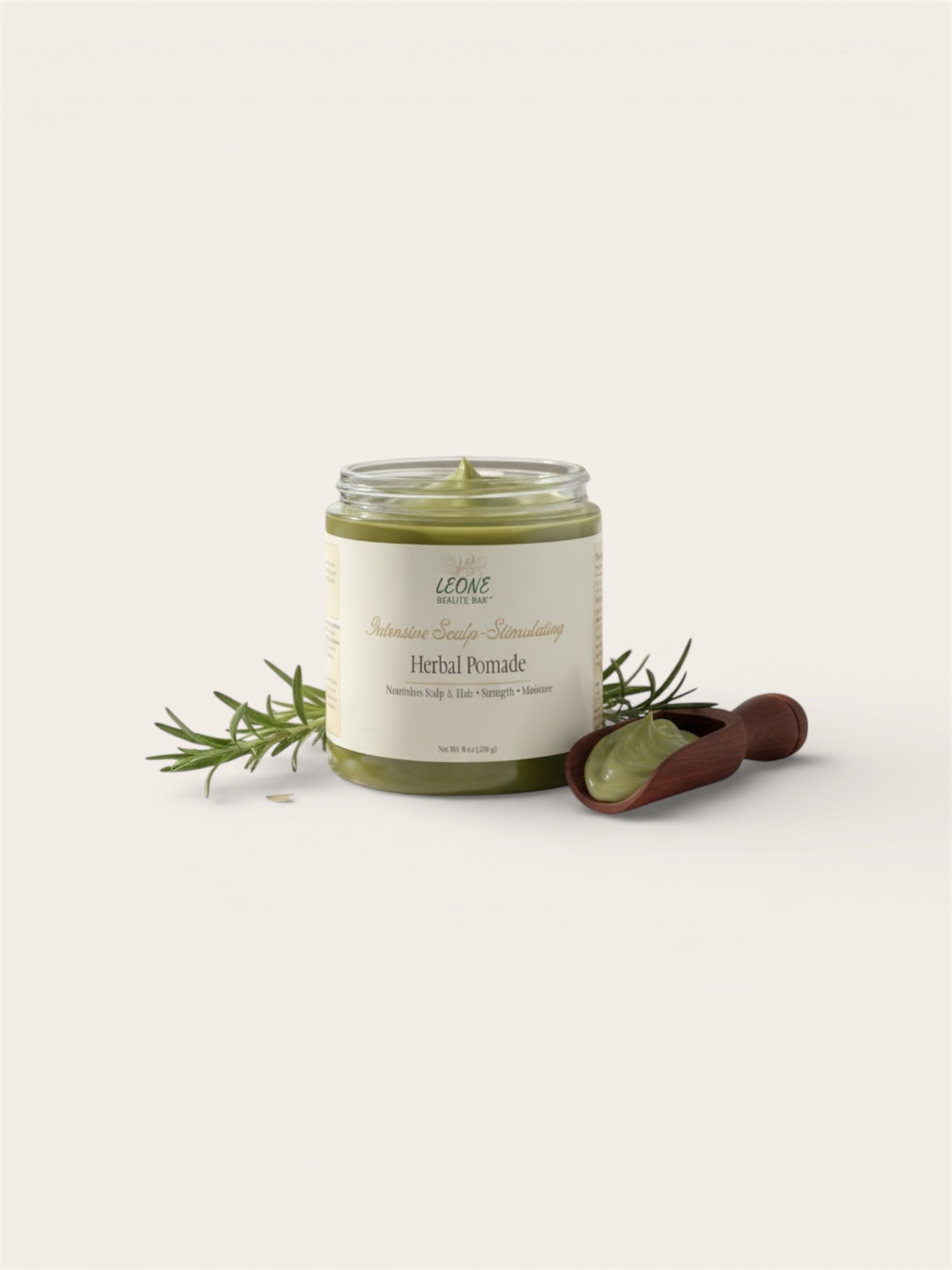 Herbal pomade jar with rosemary sprigs on a white background