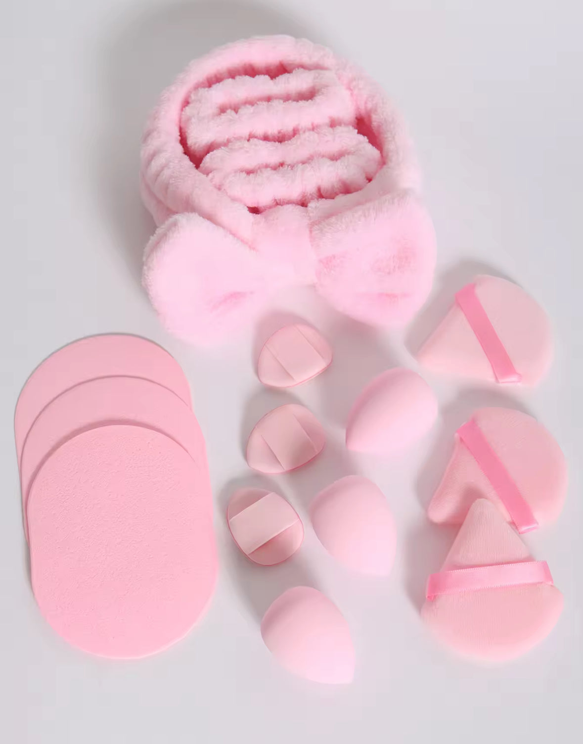 Set of pink silicone molds on a light gray background