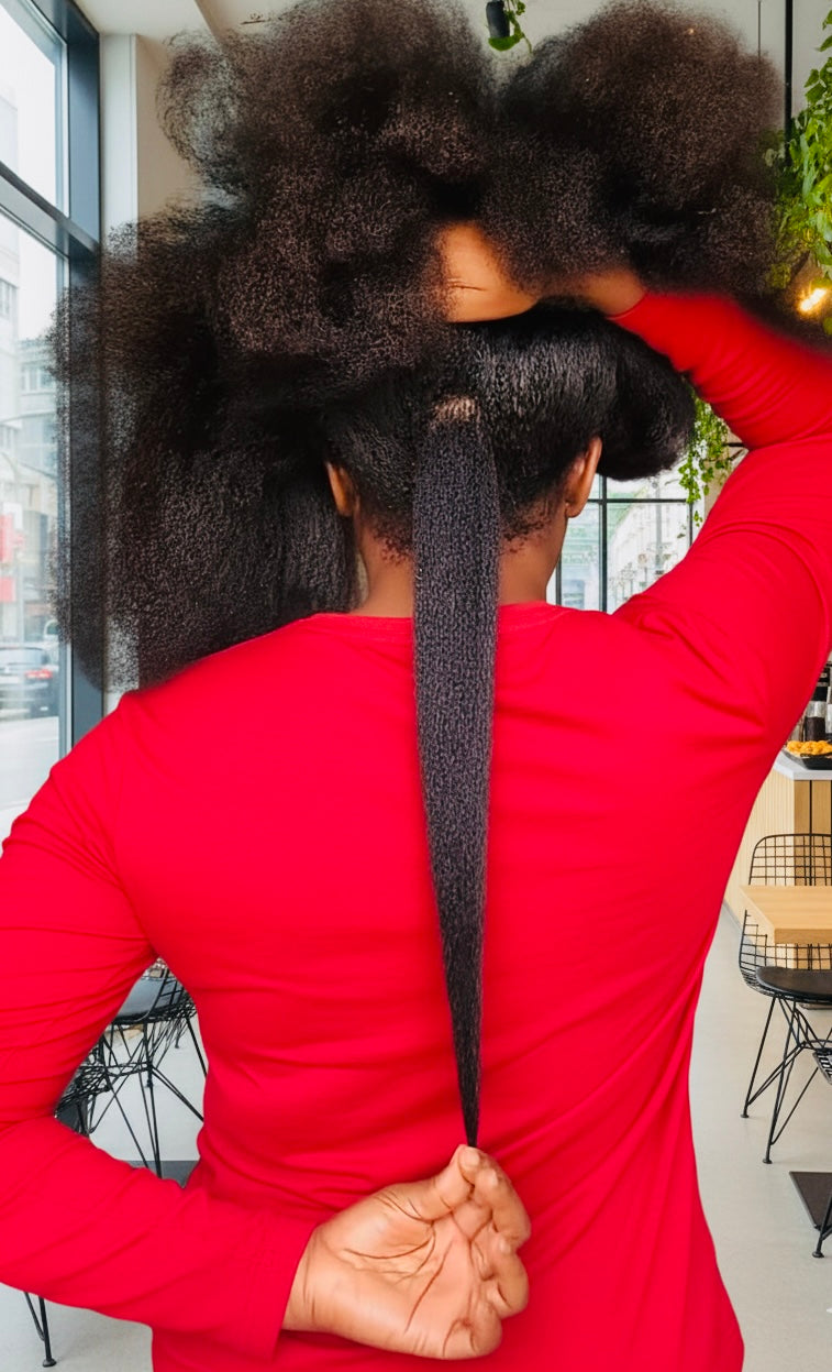 Person with styled hair in a salon setting