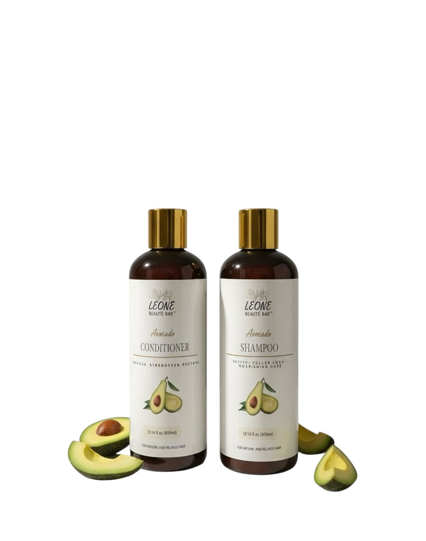 Two bottles of Leone Avocado Shampoo and Conditioner with avocado slices on a white background