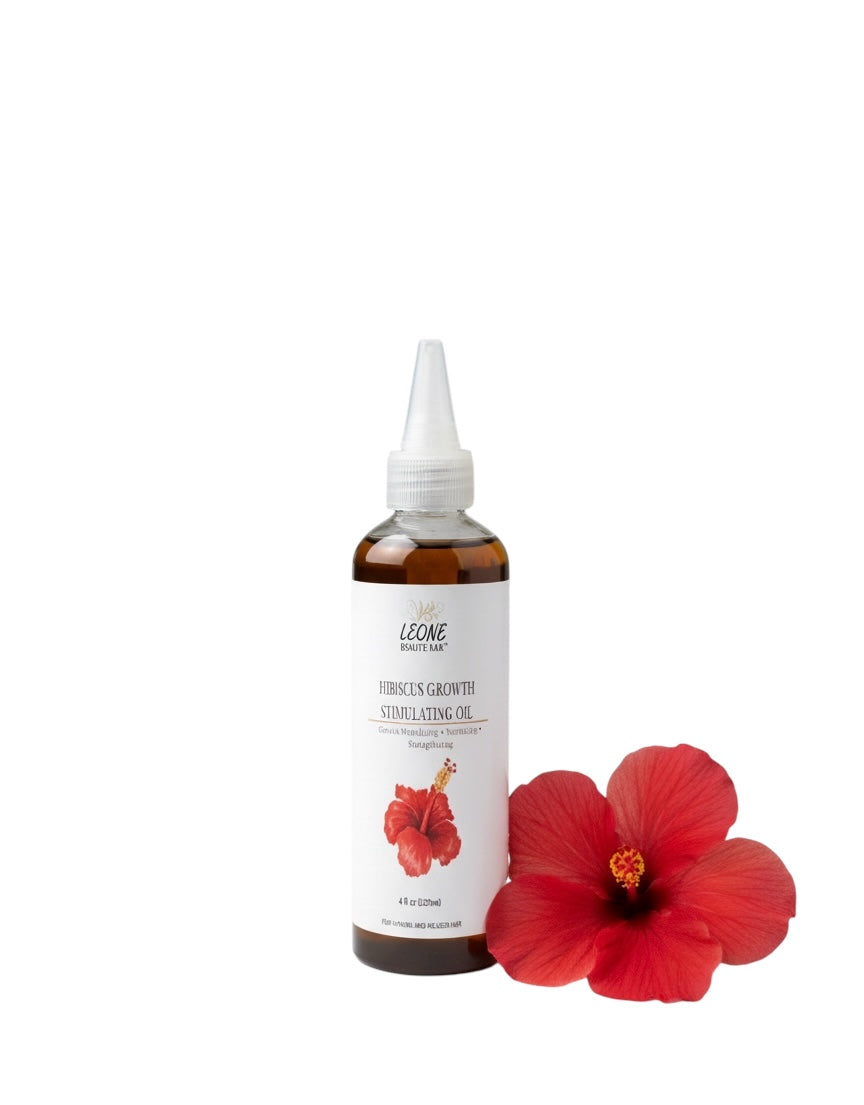Bottle of Leone hair care product with a hibiscus flower on a white background
