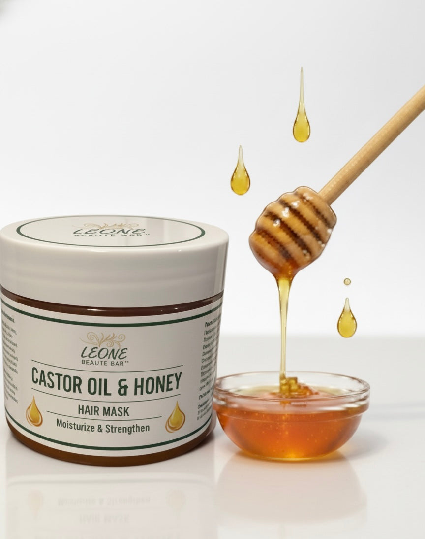 Jar of Leone Castor Oil & Honey hair mask with honeycomb and bowl on a white background